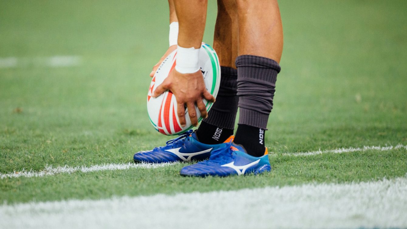 man holding rugby ball