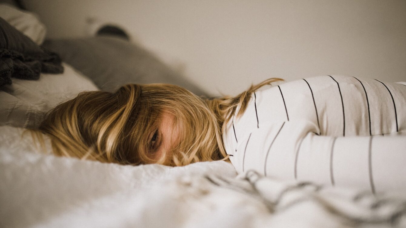 woman lying on bed